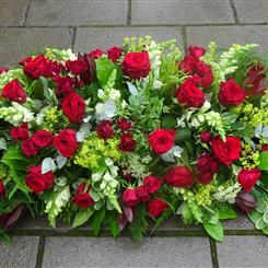 Red Roses with a touch of white - Casket Spray
