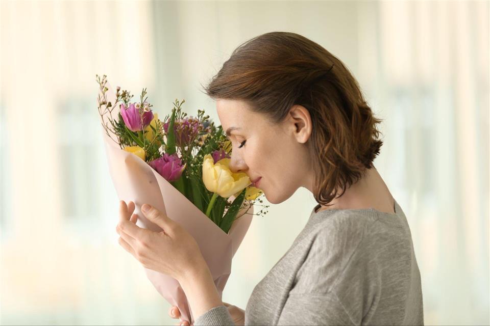 smelling flowers