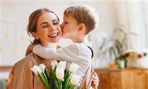 kid kissing parent