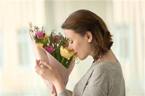 smelling flowers